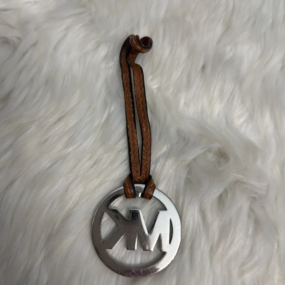 Michael Kors Fob Hang Tag Silver Color Metal Logo on Cognac Brown Leather Strap